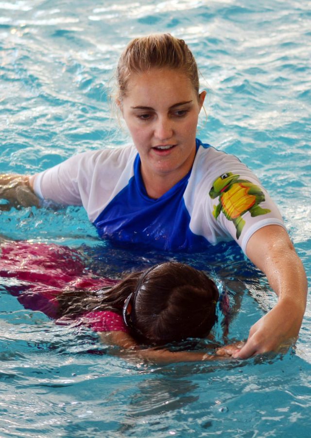 Child learns to kick and float